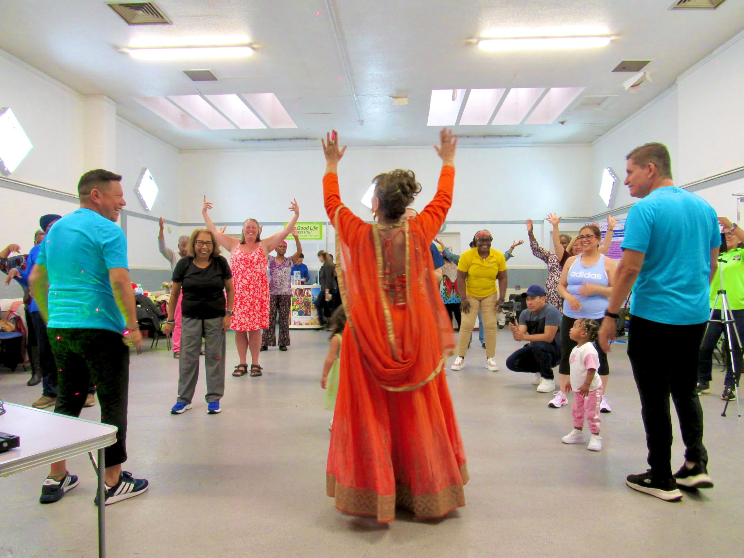 people dancing at the empowering community event from true ambassadors